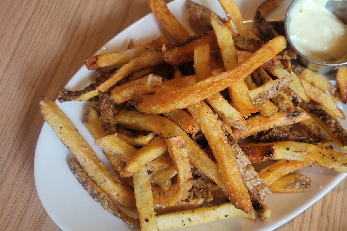 Salt & Vinegar Fries at Velvet Cellar are a must, happy hour or not. | Photo by Linnea Covington