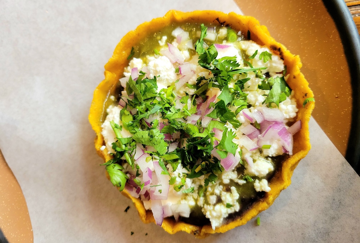 The bean and cheese sopecita is one of the items on the happy hour menu. | Photo by Linnea Covington