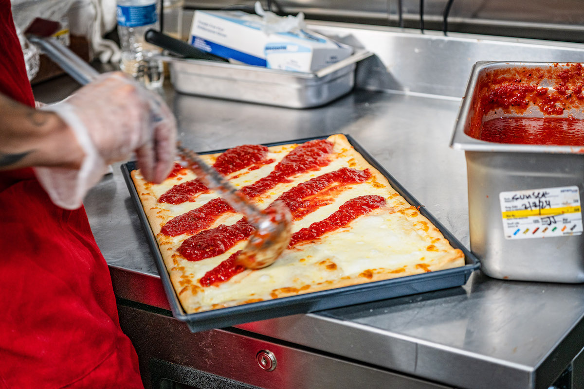 Copy of PSP_Pasadena-Ira_Edelman-6264 - DiningOut A square pie gets a slathering of sauce at Prince St. Pizza. | Photo by Ira Edelman