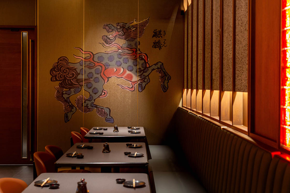 The low-lit dining room at Seven Sushi & Robata. | Photo by Jenn Duncan