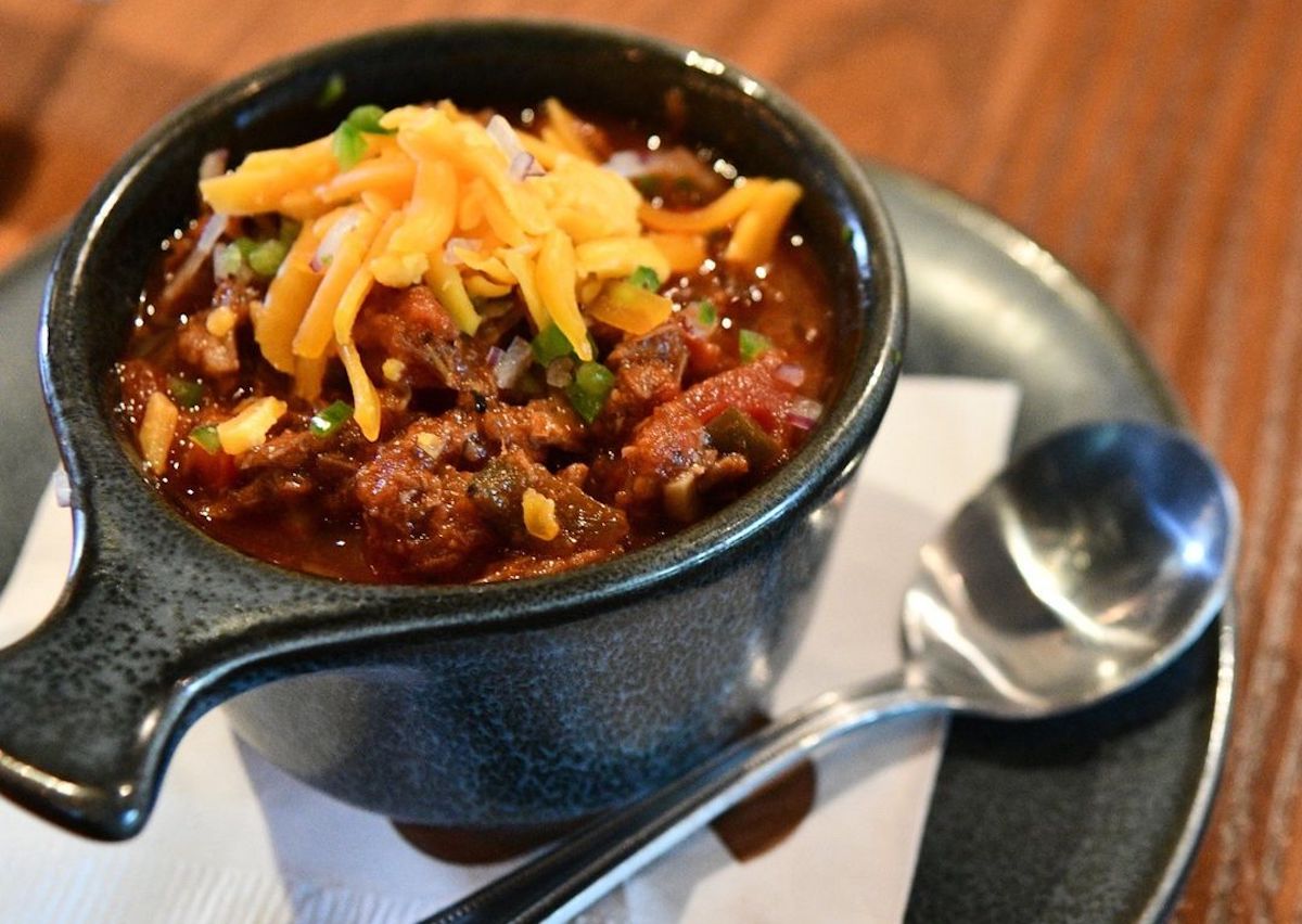 Chili topped with cheese and green scallions at King Ranch Texas Kitchen. | Photo by King Ranch Texas Kitchen