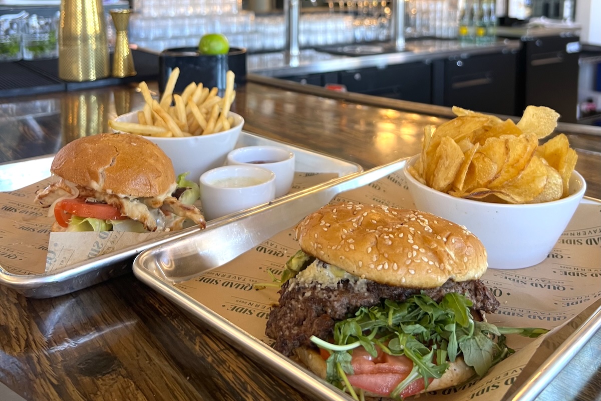 Choose from a hefty burger and hot dog menu. | Photo by Quad Side Tavern