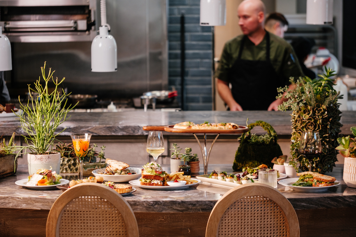A feast of dishes with views of the kitchen at the chef's table at Succulent. | Photo by Quit Nguyen