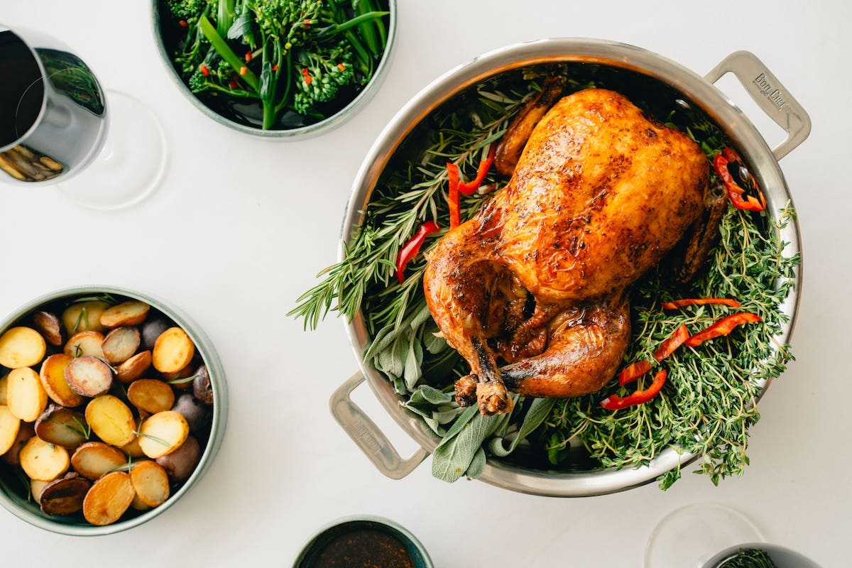 A whole turkey with potatoes and broccolini at Tavola. | Photo by Brian Kennedy