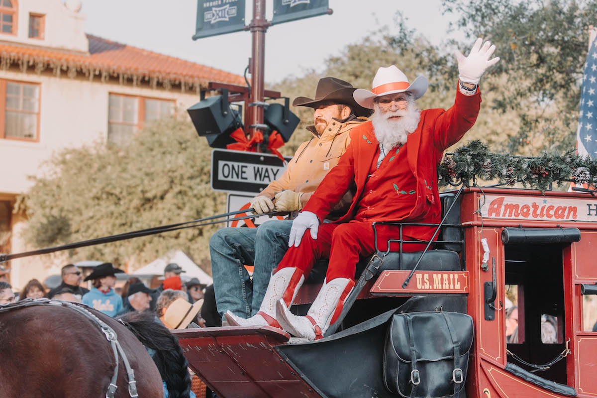Cowboy Santa waves at onlookers during a parade at Forth Worth Stockyards. | Photo by Fort Worth Stockyards