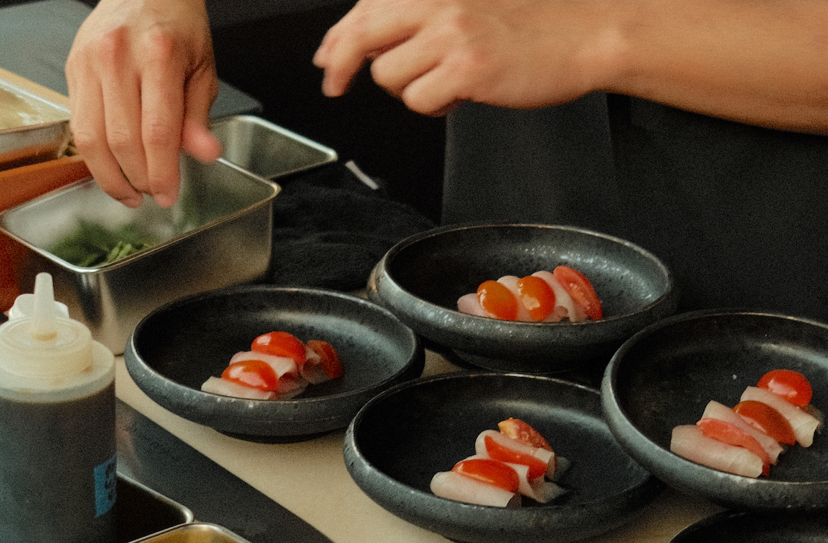 A chef prepares nigiri during an onsite omakase experience with Duckstache Hospitality. | Photo by Studio Rivera