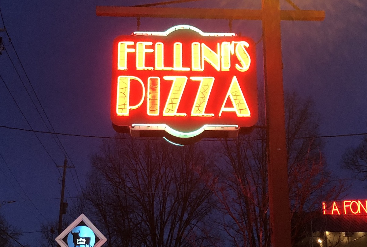 The familiar neon signs of Fellinis. | Photo by Murray Attaway