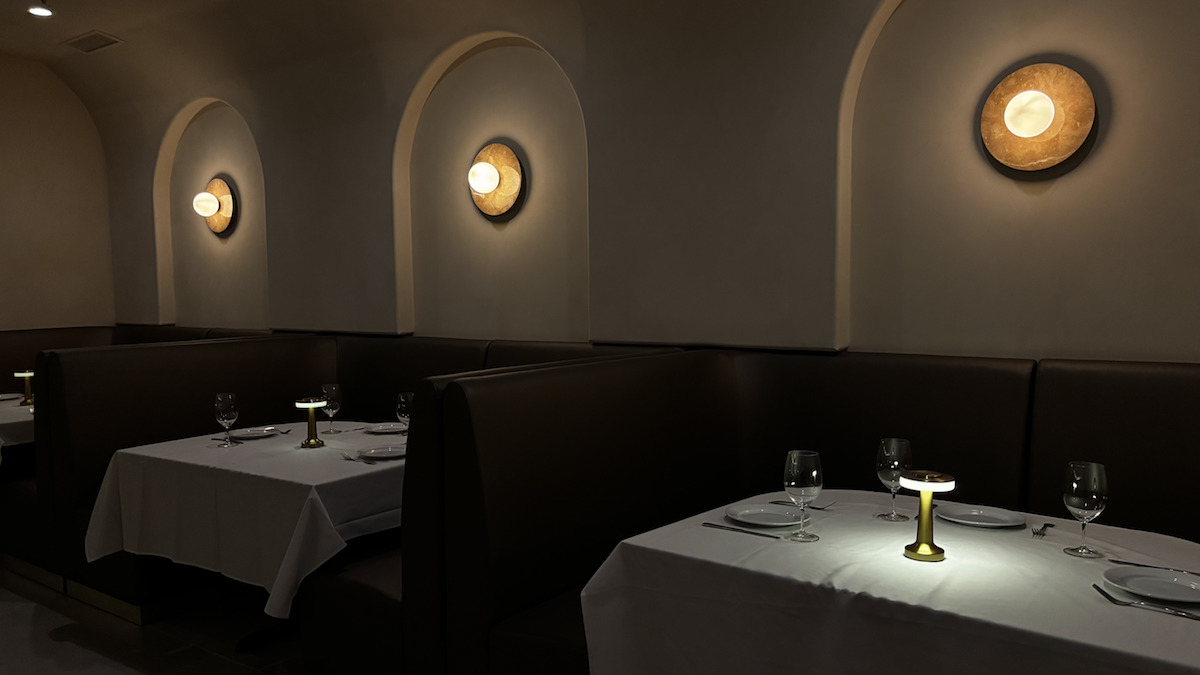 The moody, low-lit dining room at Babel. | Photo by Babel