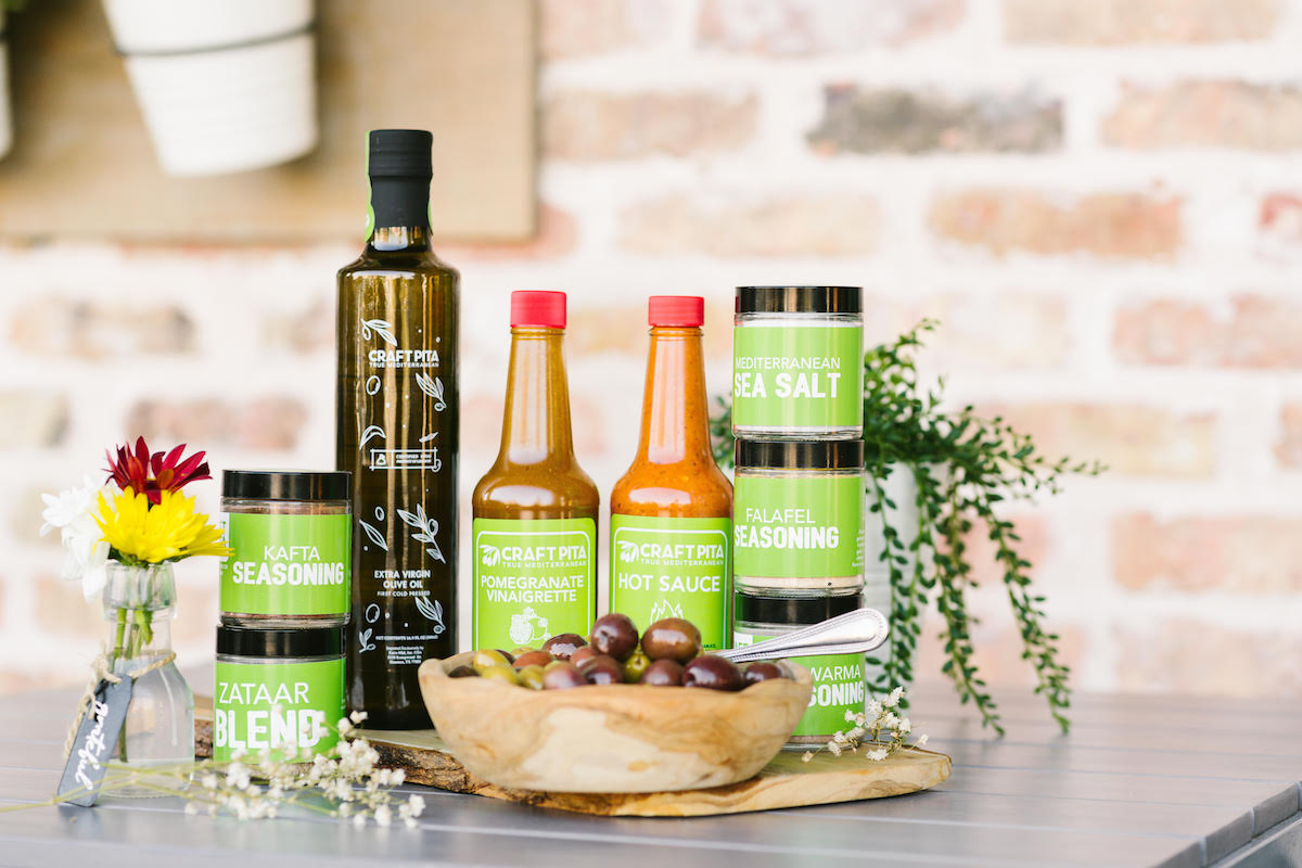 Craft Pita's sauces, oils, and spices available for gifting this holiday season. | Photo by Rebekah Flores