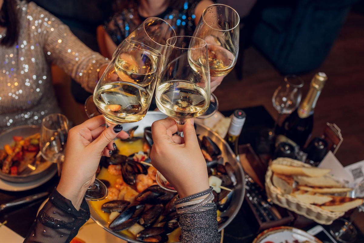 Clinking glasses with alcohol and toasting, party stock image new years eve champagne cheers ID: 205835949 By: vershininphoto