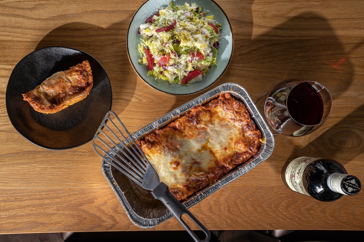 Bring home a tasty lasagna, salad, bread, and wine from Restaurant Olivia. | Photo courtesy of Restaurant Olivia