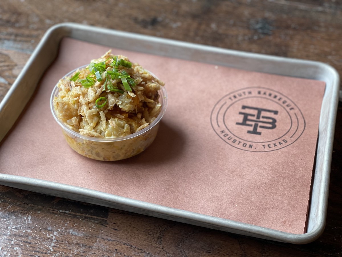 The gooey, creamy, cheesy tater tot casserole deserves the spotlight at Truth BBQ. | Photo by Ben Sassani