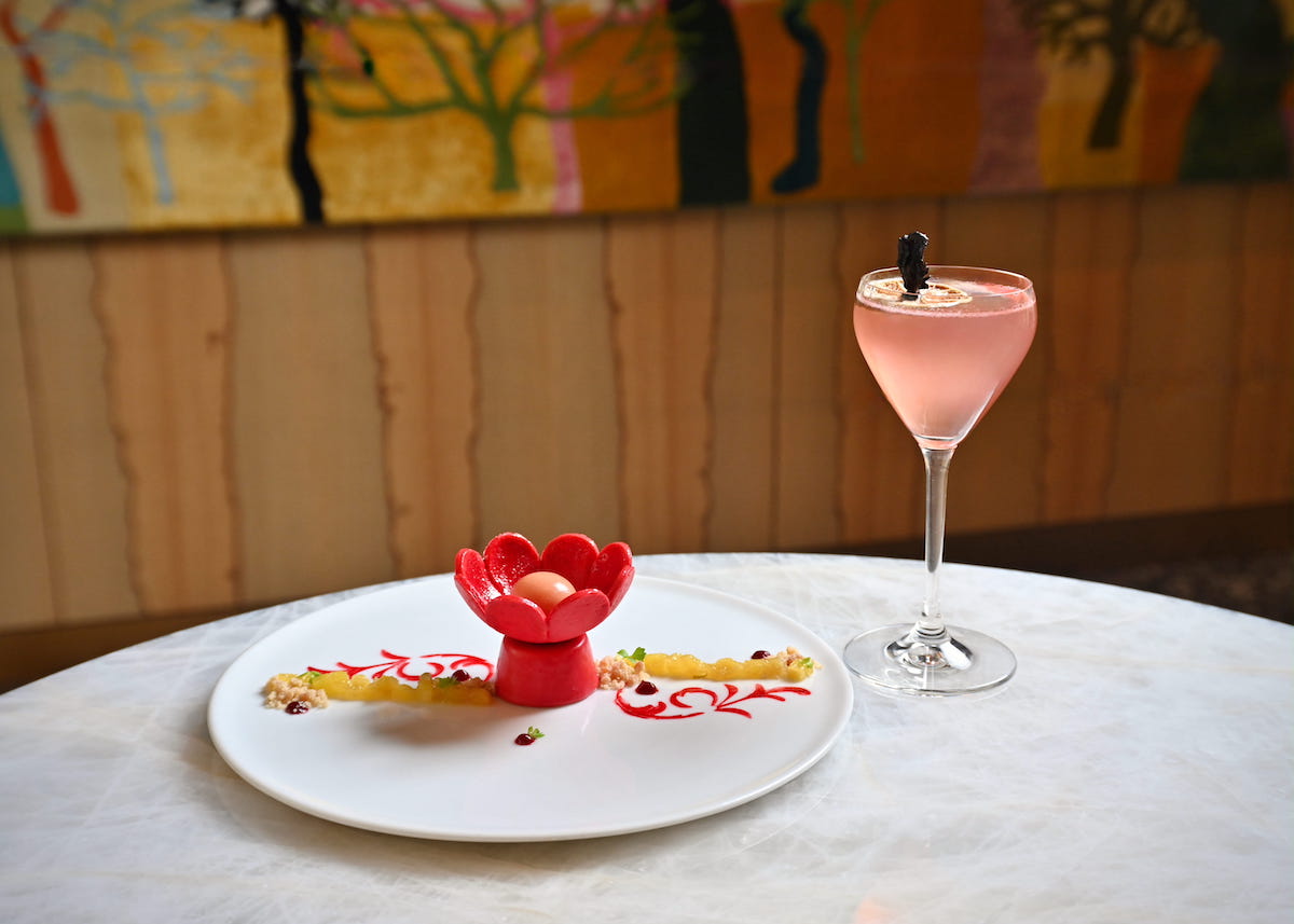 The floral-forward In Bloom dessert and mezcal-based Trazo Rojo cocktail featured in the latest installment of the Culinary Canvas series at Le Jardinier. | Photo by Alex Montoya