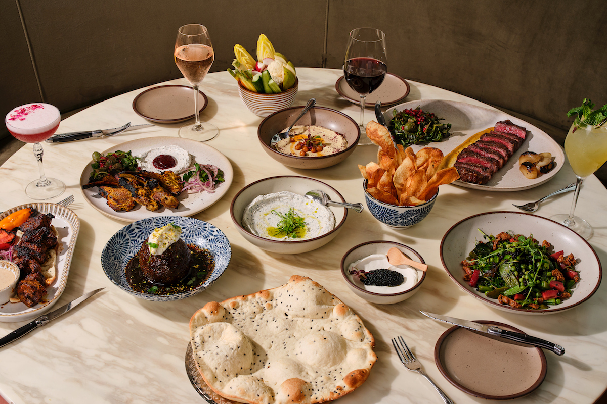 Assorted dishes, cocktails, and wine at Delbar. | Photo by Andrew Thomas Lee