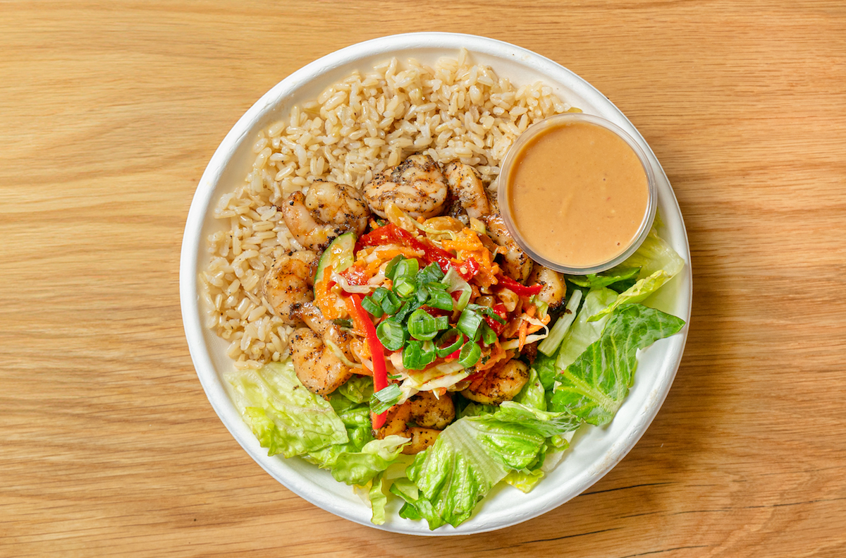 Gusto - DiningOut Ginger lime peanut bowl with Thai ginger peanut sauce and red bell pepper, cabbage, cucumber, carrot, and roasted peanut medley mixture at gusto! - healthy bowls & wraps. | Photo by gusto! - healthy bowls & wraps