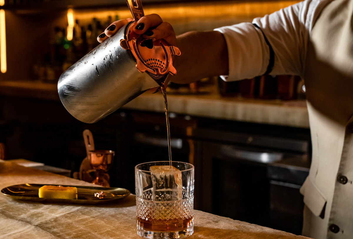 Crafting Queen Mary’s Navy Strength Old Fashioned during a one-night pop-up at Bandista. | Photo by Four Seasons Houston