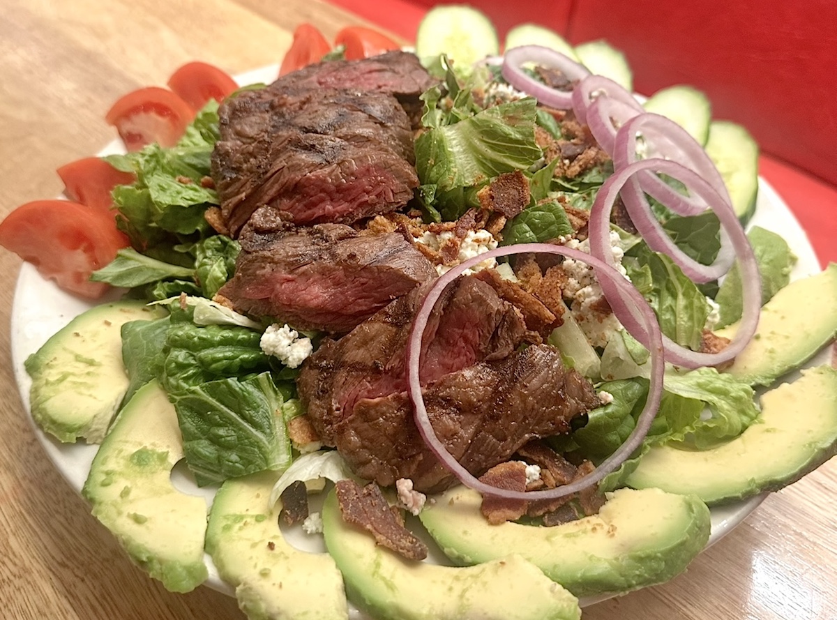 The Roumanian steak salad at Kenny & Ziggy's. | Photo by Paula Murphy
