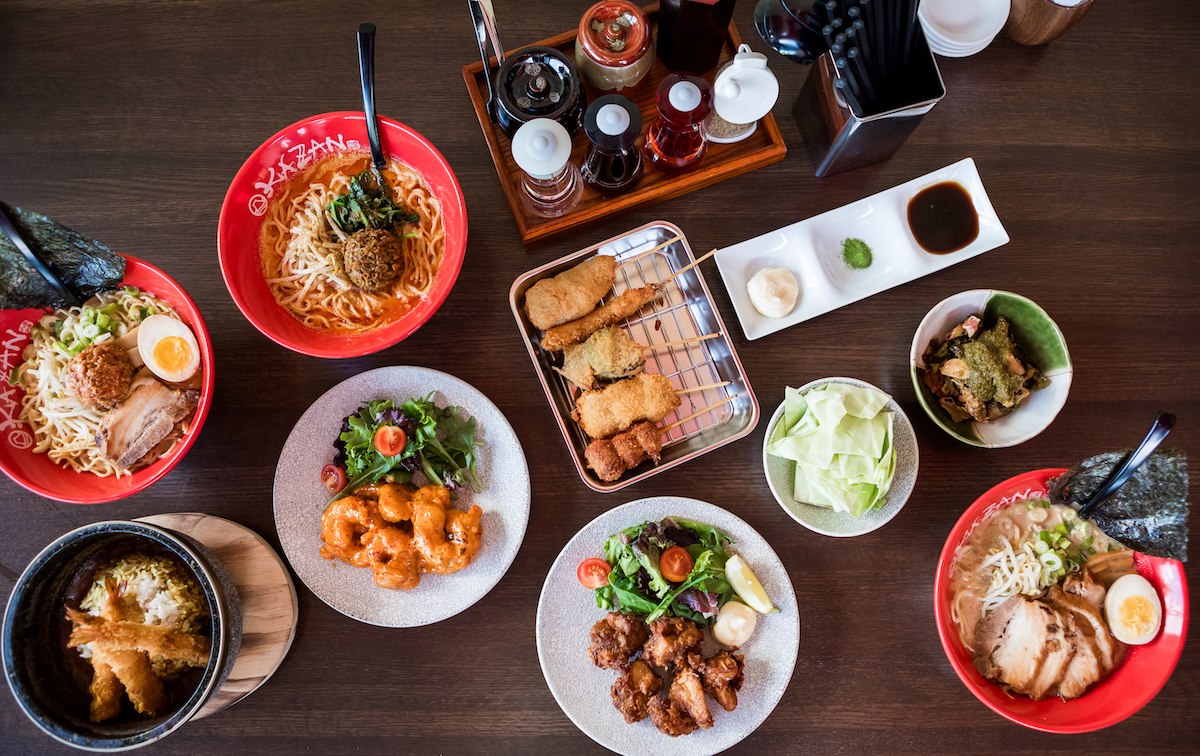 Kazzan Ramen Bar Dishes by Traci Ling - DiningOut An assortment of dishes and ramen bowls with accomaniments at Kazzan Ramen & Bar. | Photo by Tracy Ling