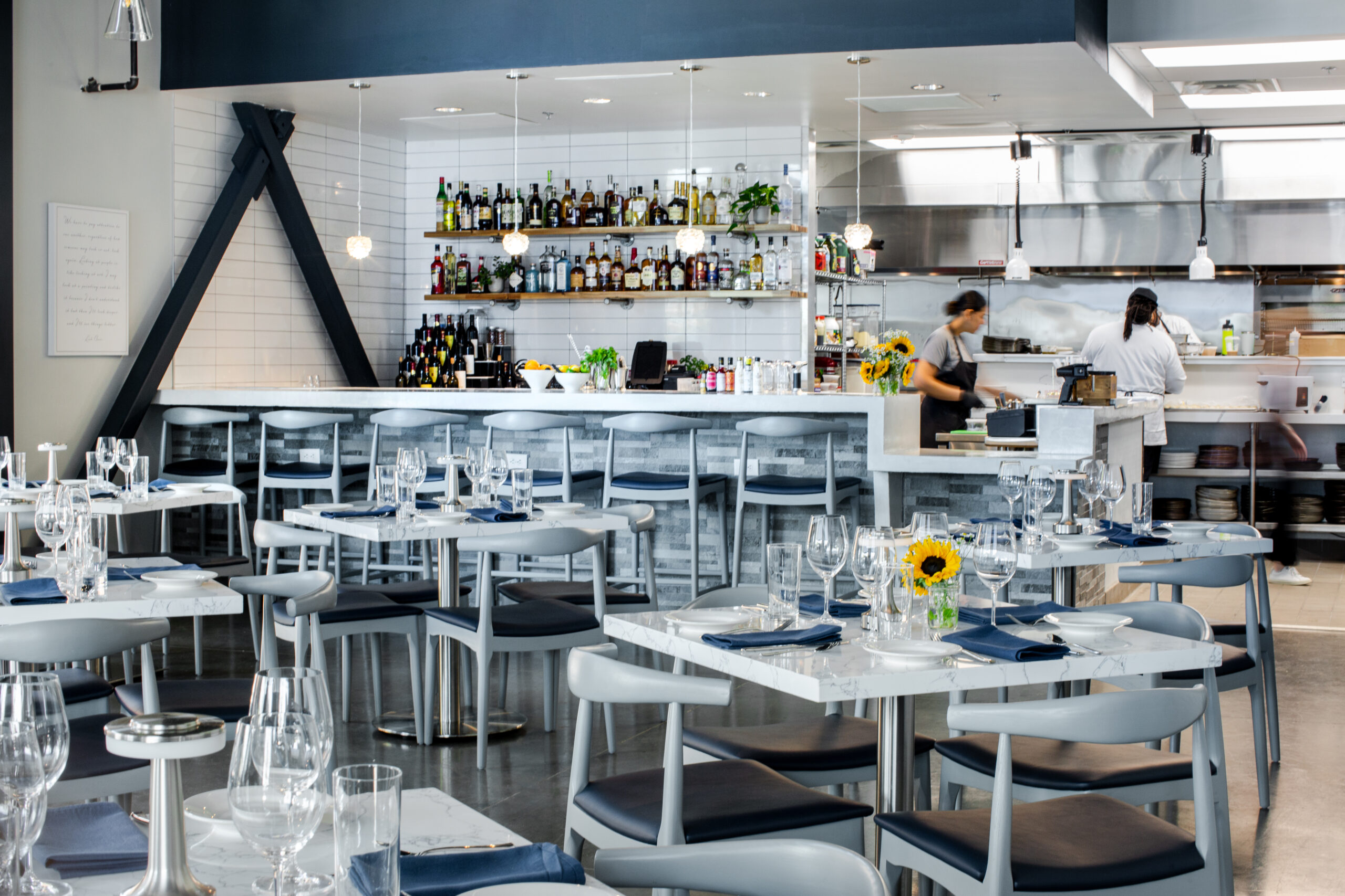 Views of the open kitchen and bar from the dining room at Roots Southern Table. | Photo by Roots Southern Table