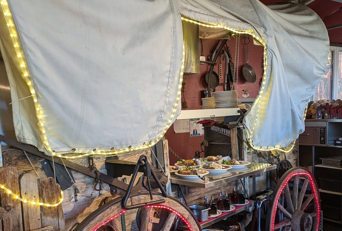 Grab a drink from the covered wagon that was converted into a bar. | Photo courtesy of Buckhorn Exchange