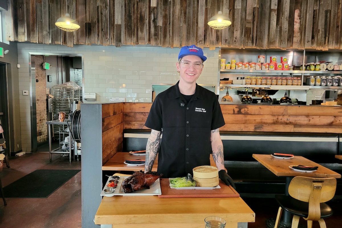 Ace Eat Serve's executive chef Stewart Gray about to carve a Peking Duck tableside. | Photo by Linnea Covington