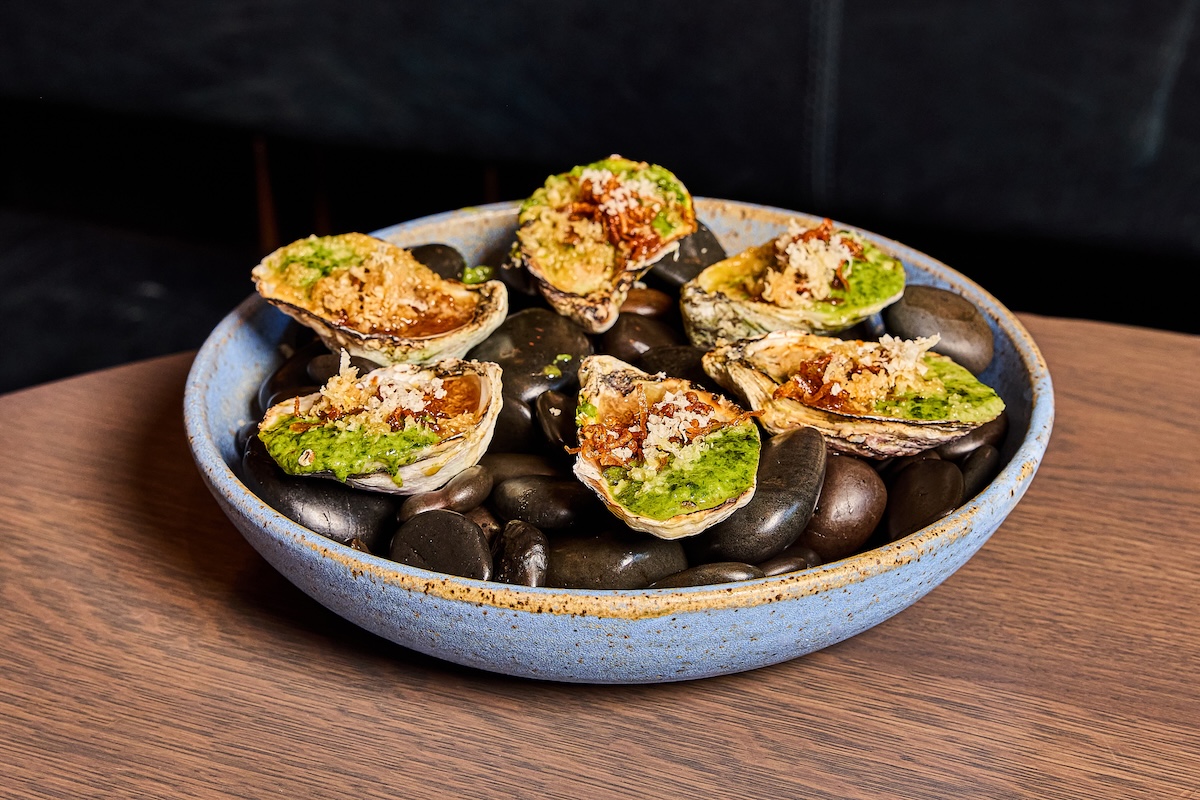 Hearth-roasted oysters with koji creamed spinach, and ponzu. | Photo by Uchiko