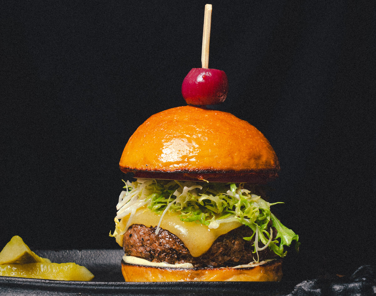 Burger built on milk bread at Toga, coming soon from Comma Hospitality. | Photo by Comma Hospitality