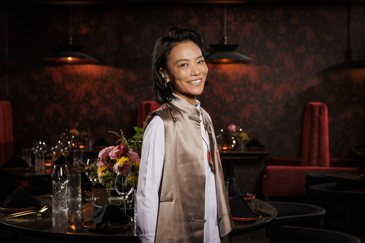 Top Chef finalist, chef Shirley Chung smiles in the dining room at her new Design District restaurant, Night Rooster. | Photo by Samantha Marie Photography