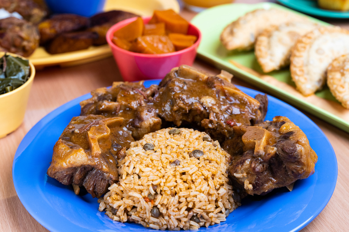 Oxtails, rice and beans, with yams at Comfort Foodies. | Photo by Comfort Foodies