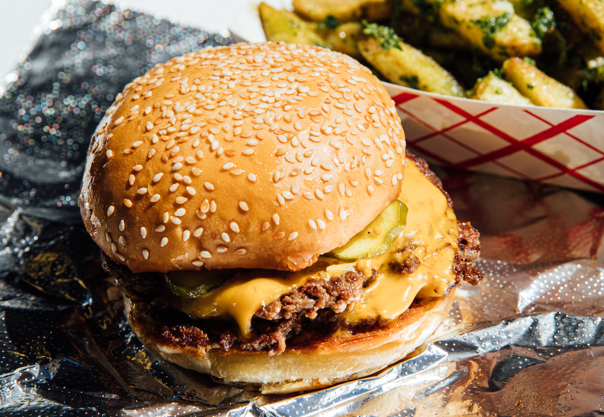 Cheeseburger built on a sesame seed bun at Fred's Meat & Bread. | Photo by Fred's Meat & Bread