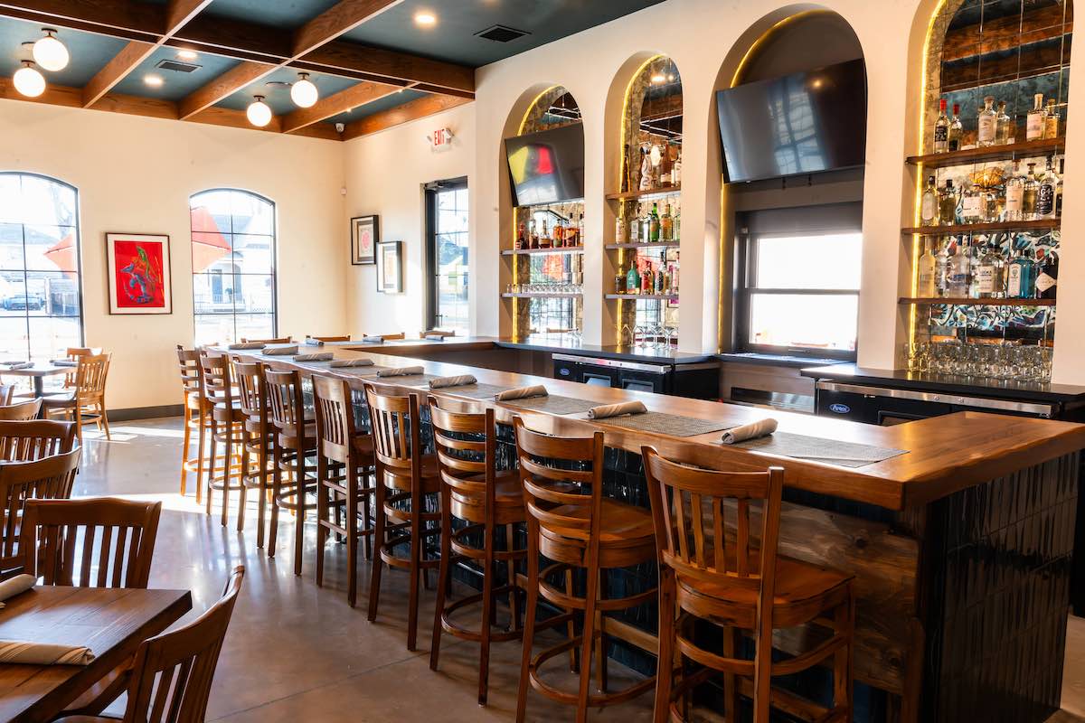 Ample seating at the wood bar at Johnny Ritas. | Photo by Hasan Yousef