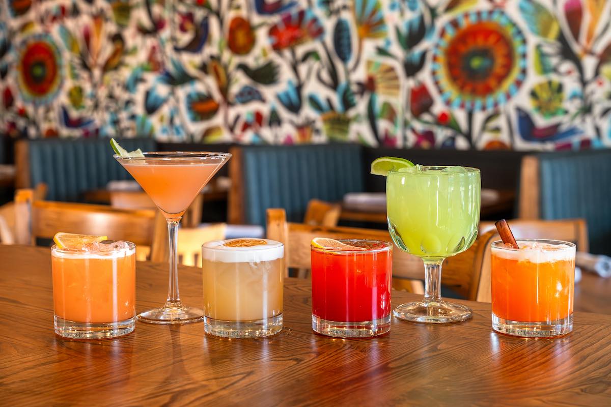 The colorful cocktail lineup at Johnny Ritas. | Photo by Hasan Yousef