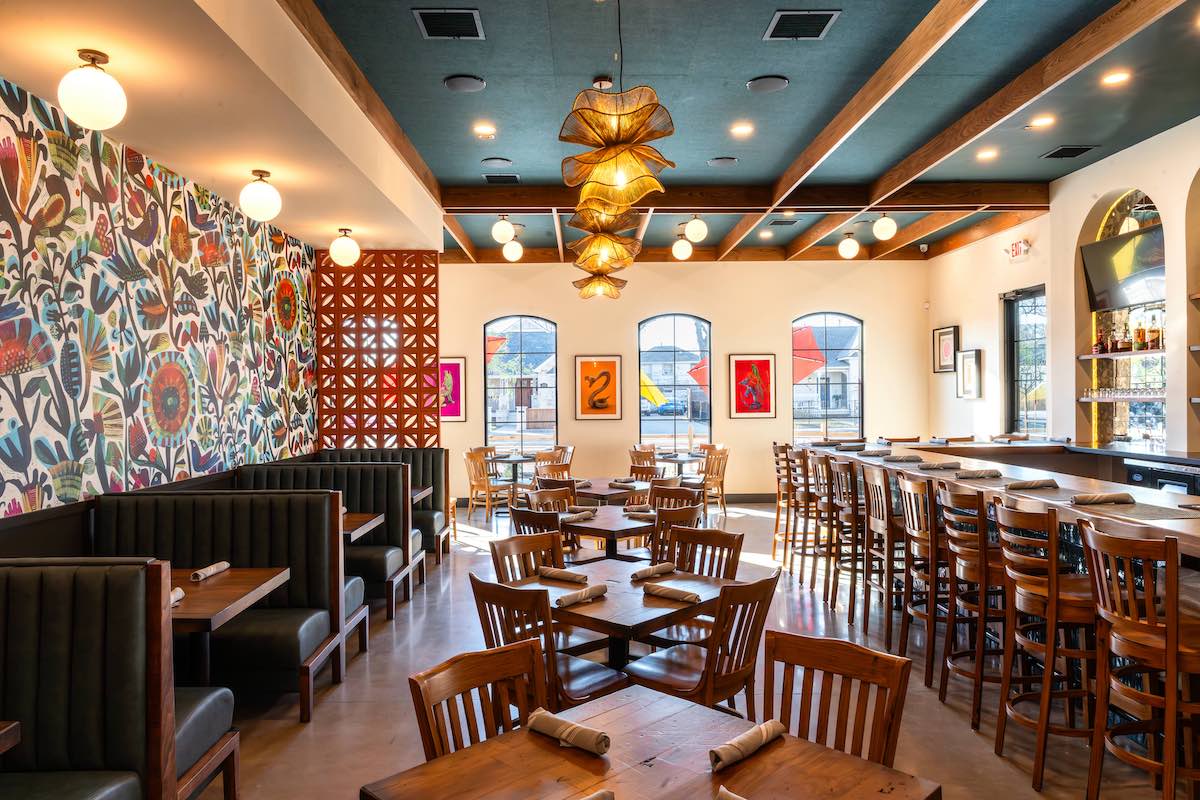 Custom booths and tables fill the dining room at Johnny Ritas. | Photo by Hasan Yousef