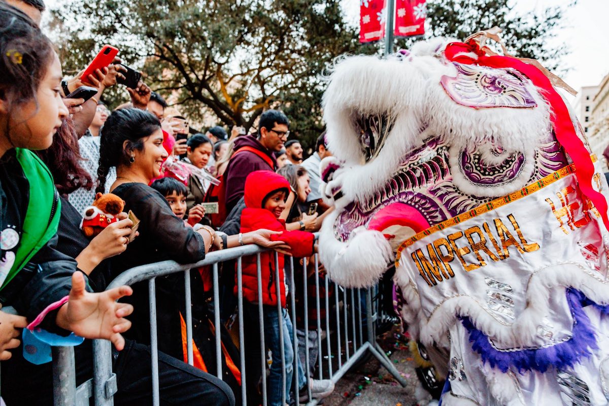 A dragon dancer greets the crowd at the celebration at Market Square Park. | Photo by Market Sqaure Park