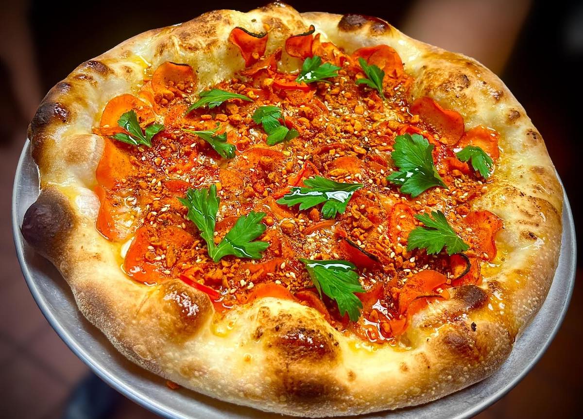 Mimo - DiningOut Roasted carrot pizza with sauce soubise, house dukka, and fresno peppers at Mimo. | Photo by Mimo