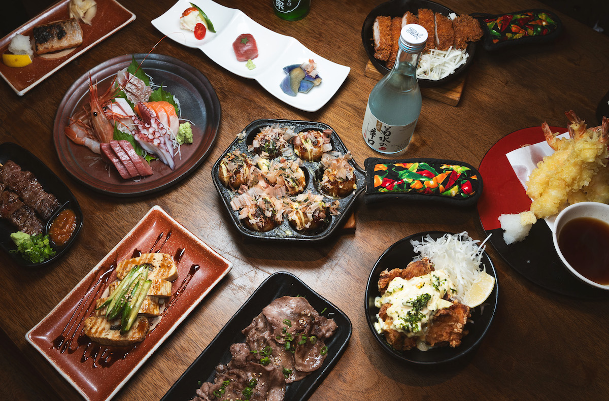 A spread of hot and cold dishes at Mr. Max, located in an Irving strip mall. | Photo by Mr. Max