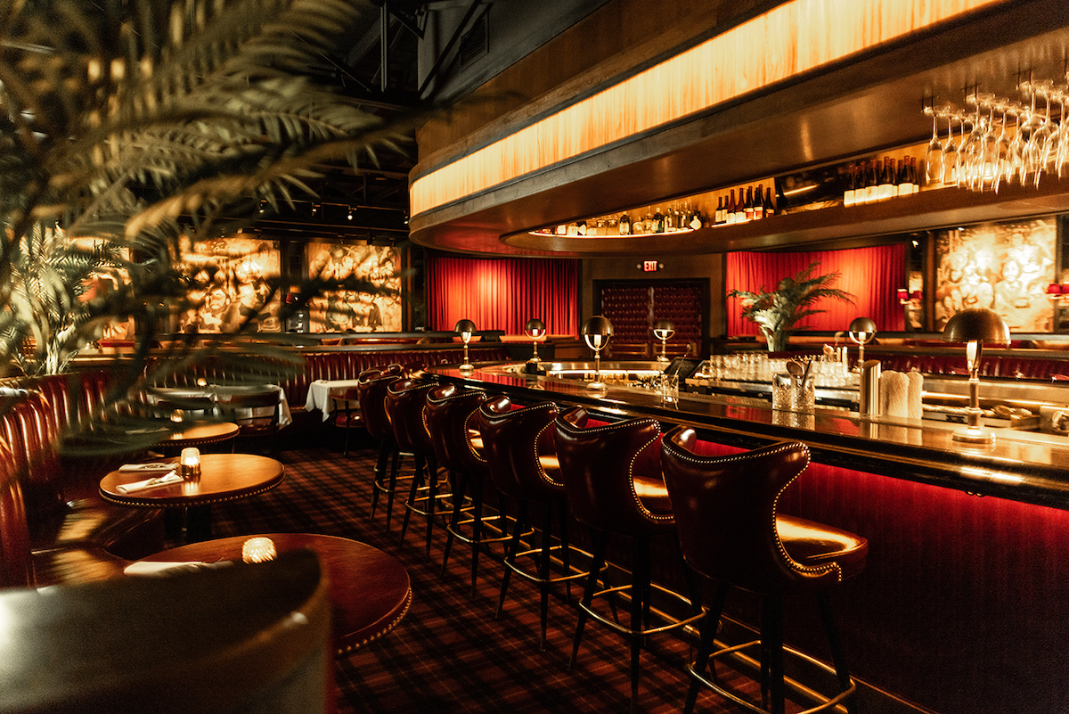The dimly lit dining room and bar at Drake's Hollywood. | Photo by Kathy Tran