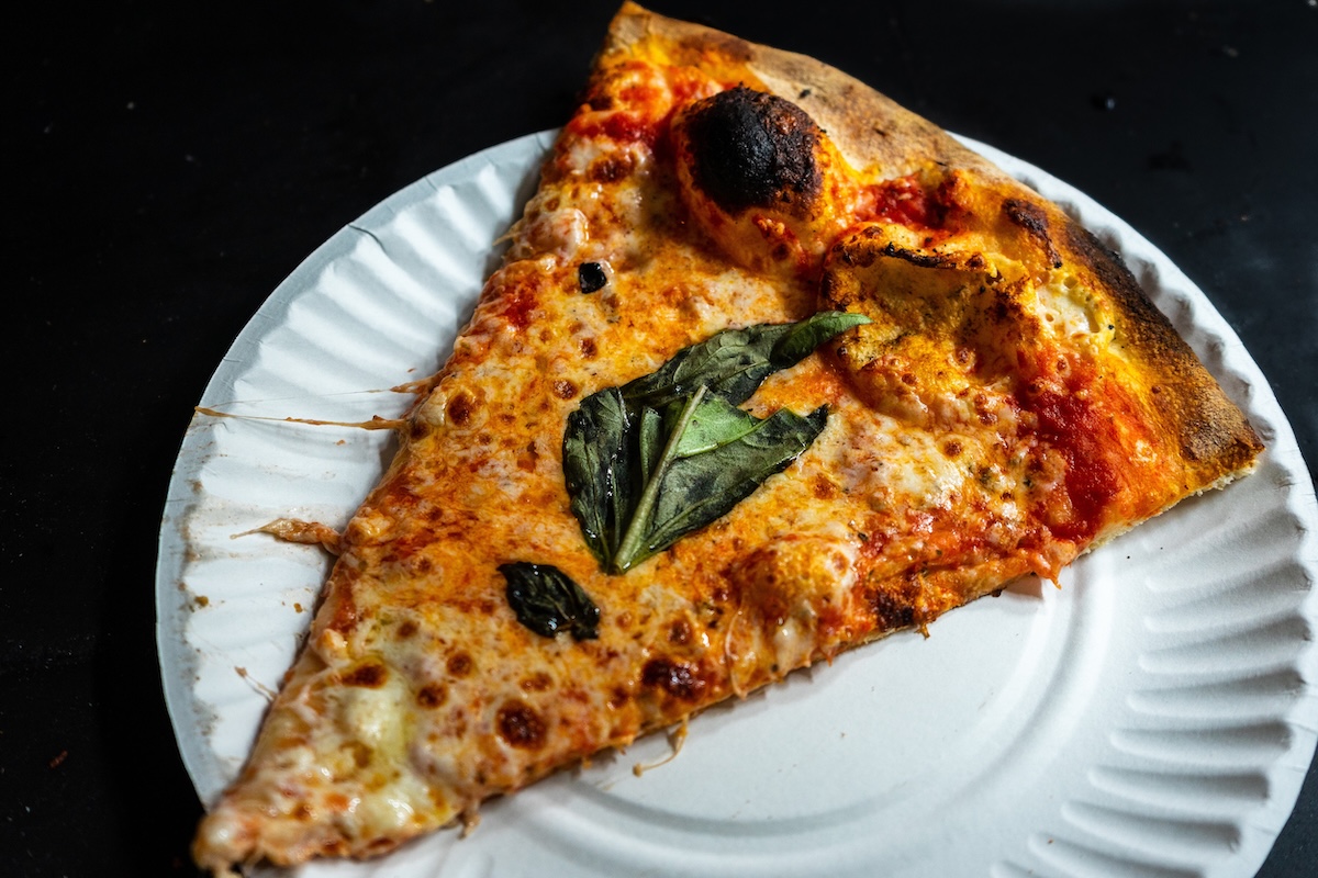 Delicious pizza close up on wooden board and concepts. Italian national food. Id_57893940