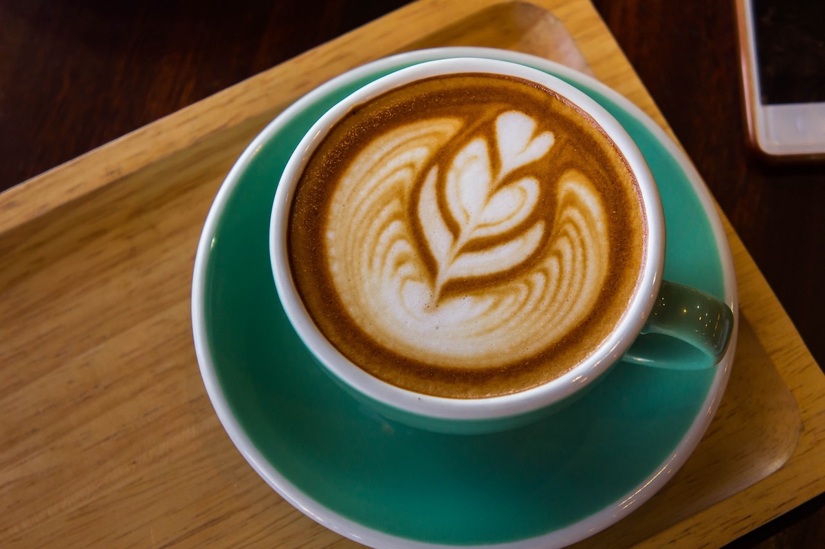 coffee time in the wood table cafe , drink coffee and tasty cake mage ID: 100245262 by: aboutnuylove