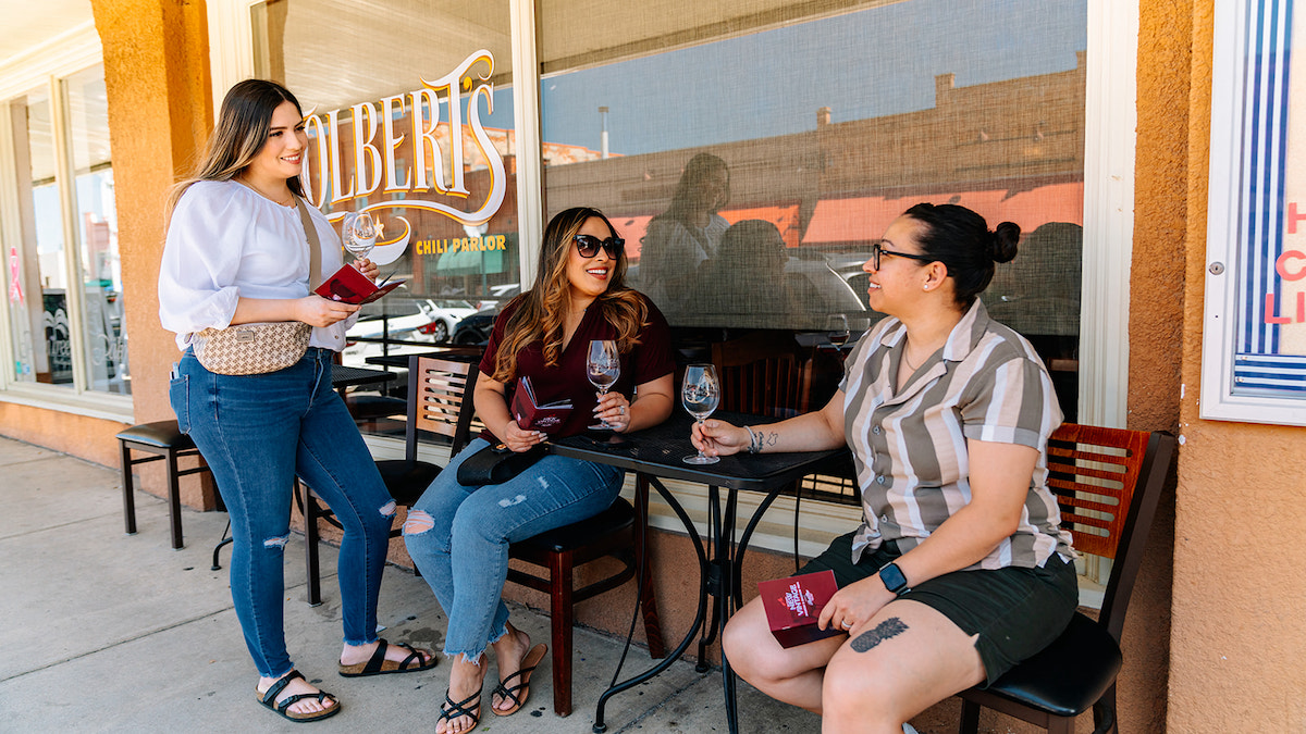 A trio sip wine outside of Tolbert's in Grapevine. | Photo by Grapevine CVB