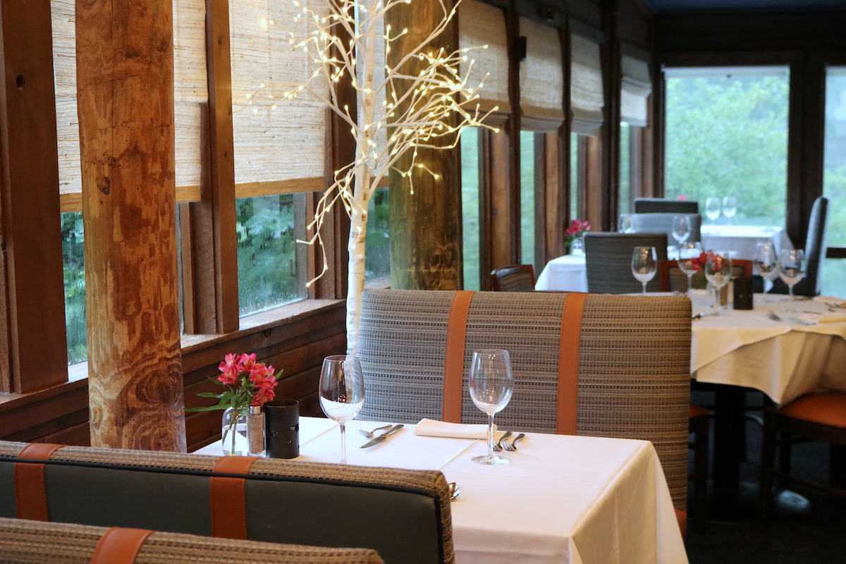A table by the window in the Creek Room at Rainbow Lodge. | Photo by Rainbow Lodge