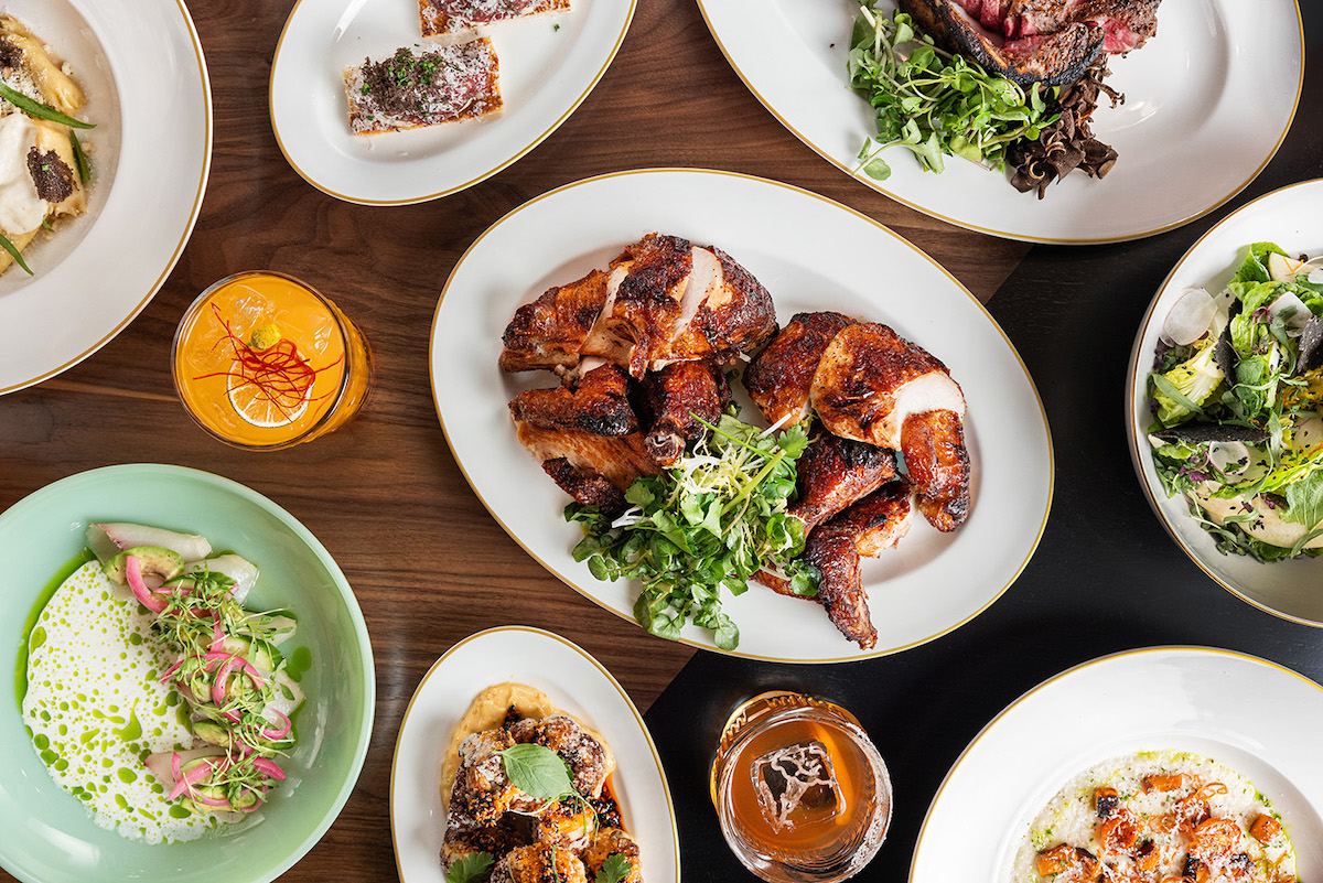 Whole roasted chicken and other dishes at Delilah Dallas. | Photo by Kathy Tran