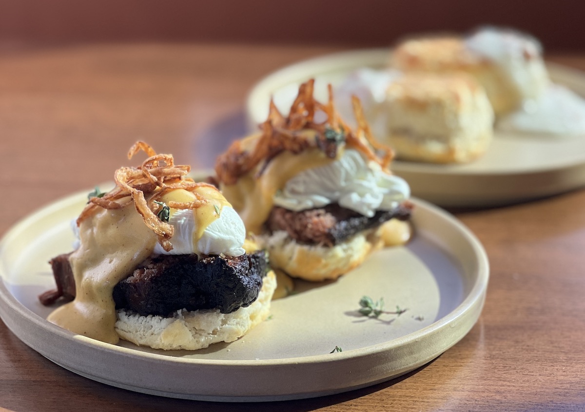Biscuits topped with brisket and poached eggs at Ferah Smoke House + Cantina. | Photo by Ferah Smoke House + Cantina