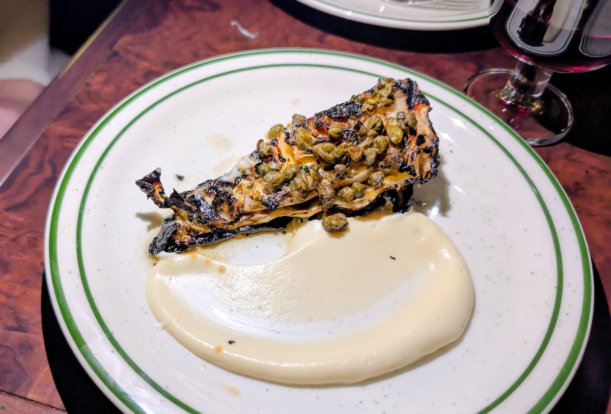 Pair the Charred Cabbage with any drink for a rich combo. | Photo by Linnea Covington