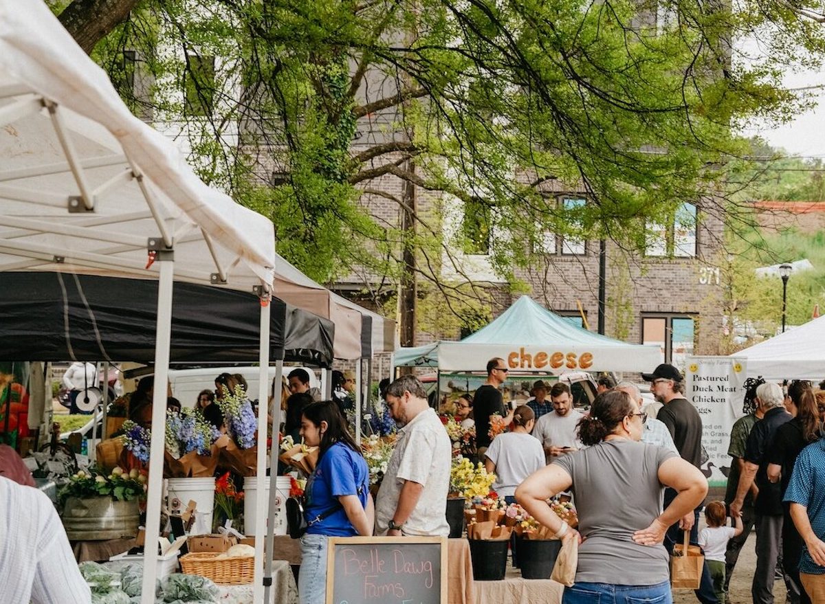 Grant Park - DiningOut Market shoppers gather around farmers market vendors selling fresh flowers, cheese, and vegetables at Grant Park Farmers Market. | Photo by Grant Park Farmers Market