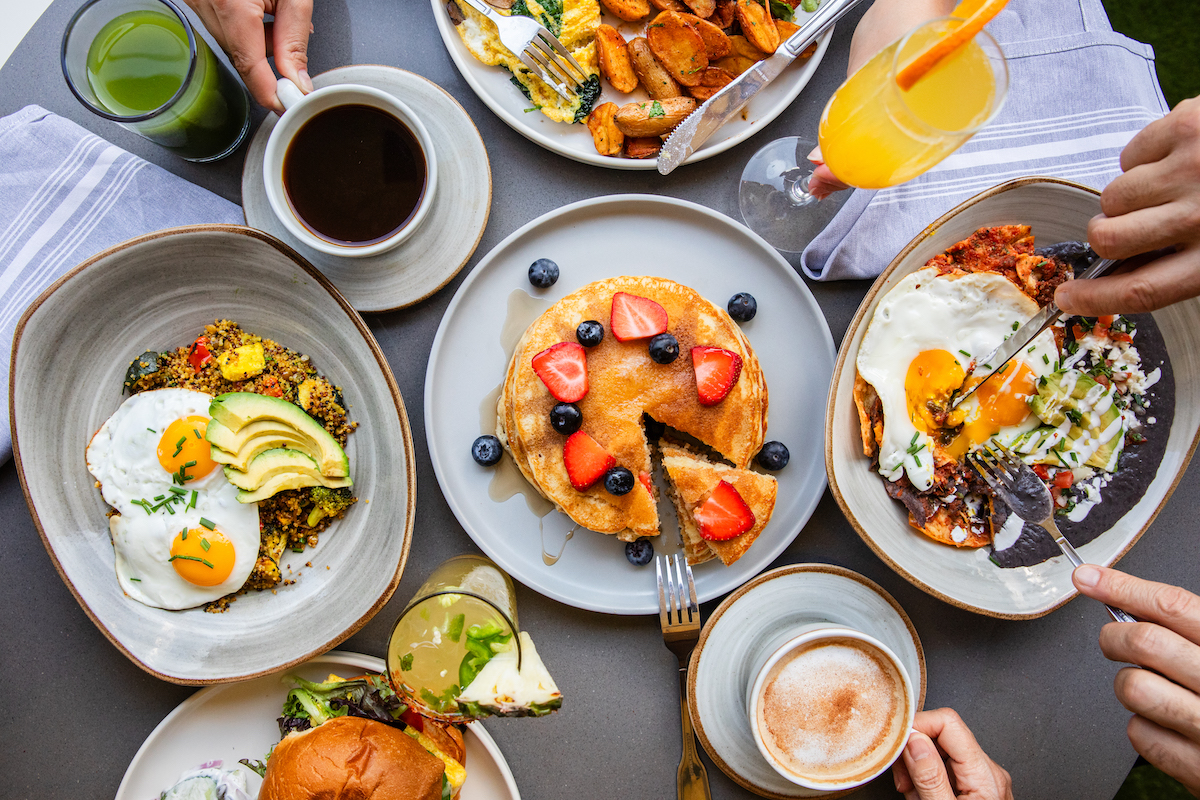 Sweet and savory brunch plates with cocktails at Hungry's. | Photo by Becca Wright