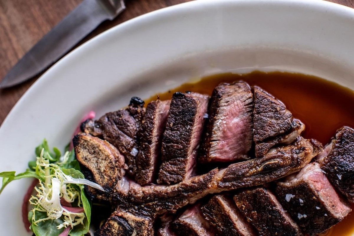 A steak at Kevin Rathbun Steak sliced to reveal a blushing, perfectly cooked center. | Photo by Kevin Rathbun Steak