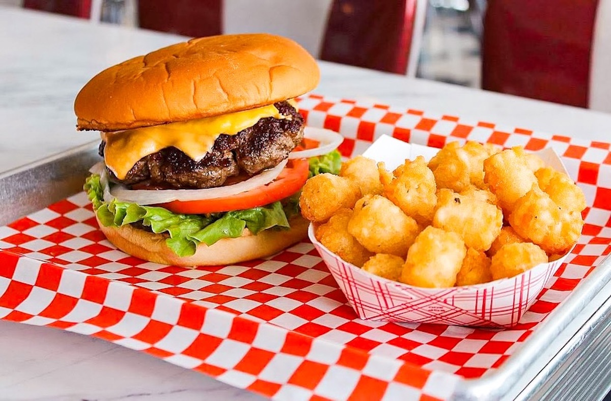 Killens Burgers - DiningOut A cheeseburger with tater tots at Killen's Burgers. | Photo by Killen's Burgers