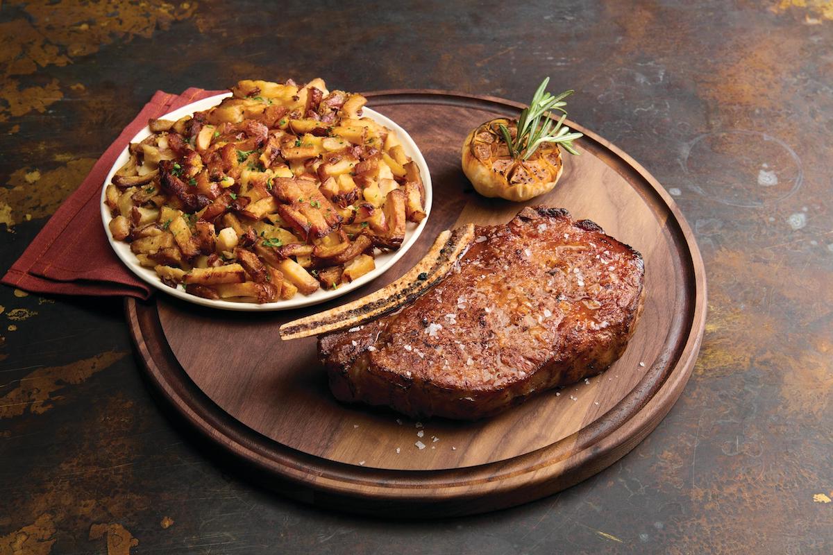 Bone-in ribeye at the Palm. | Photo by the Palm