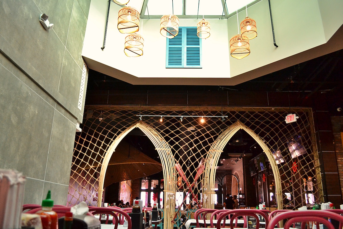 A hexagon skylight illuminates the dining room at Crawfish Cafe and Pho Prime's dual concept. | Photo by POP Studios PR